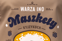 Karmelowy fortuch „Warza ino maszkety”